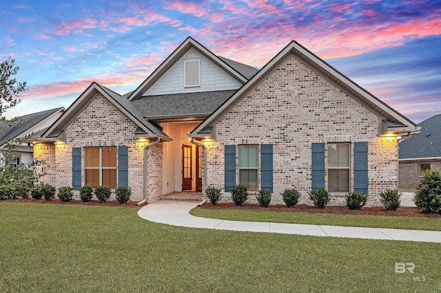 craftsman-style house with a yard