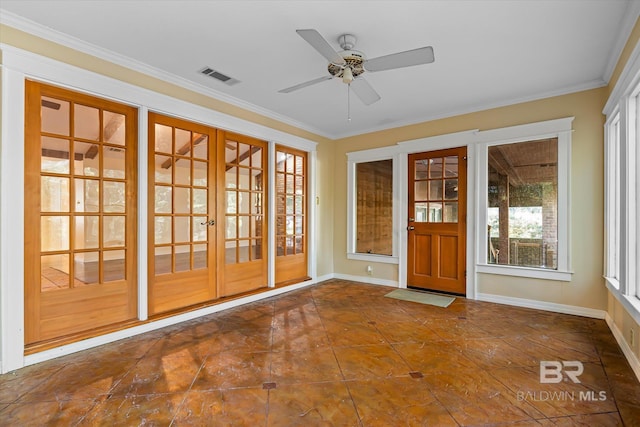 unfurnished sunroom with ceiling fan and french doors