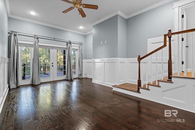 foyer with ceiling fan, dark hardwood / wood-style floors, crown molding, and french doors