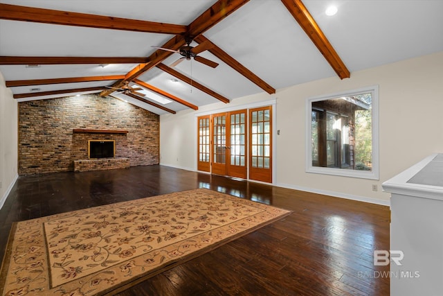 living room featuring vaulted ceiling with beams, ceiling fan, dark hardwood / wood-style flooring, and a fireplace