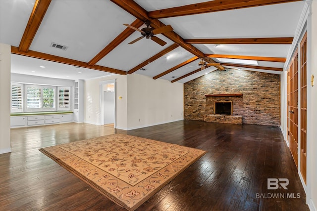 unfurnished living room with vaulted ceiling with beams, ceiling fan, dark hardwood / wood-style floors, and a fireplace