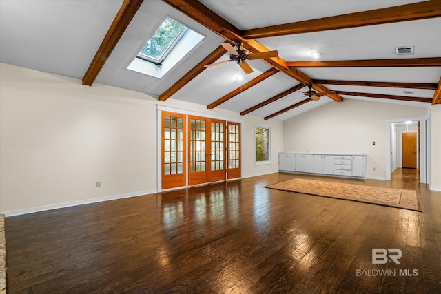 unfurnished living room with ceiling fan, wood-type flooring, and lofted ceiling with skylight