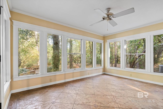 unfurnished sunroom with ceiling fan