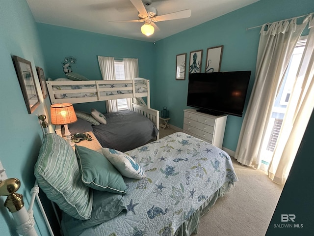 carpeted bedroom with a ceiling fan