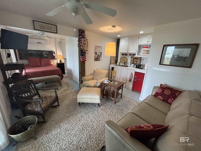 living room featuring ceiling fan and recessed lighting