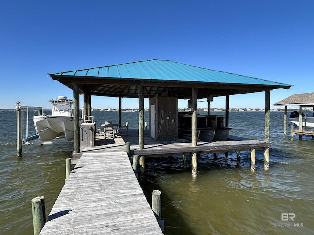 view of dock featuring a water view and boat lift