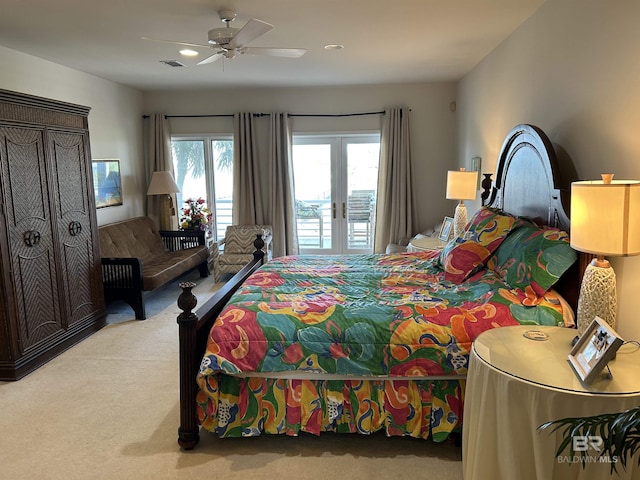 bedroom featuring ceiling fan, carpet, visible vents, and access to outside