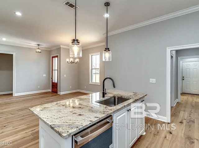 kitchen featuring visible vents, white cabinetry, ornamental molding, a sink, and dishwasher