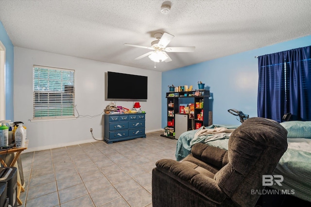 tiled living room with ceiling fan and a textured ceiling