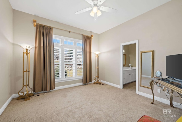 bedroom featuring ensuite bath, carpet flooring, a ceiling fan, and baseboards