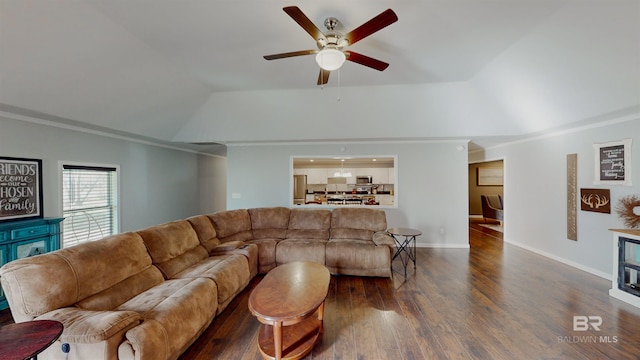 living room with ceiling fan, dark hardwood / wood-style flooring, crown molding, and vaulted ceiling