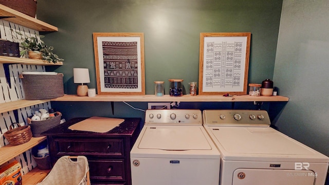 clothes washing area with washer and dryer