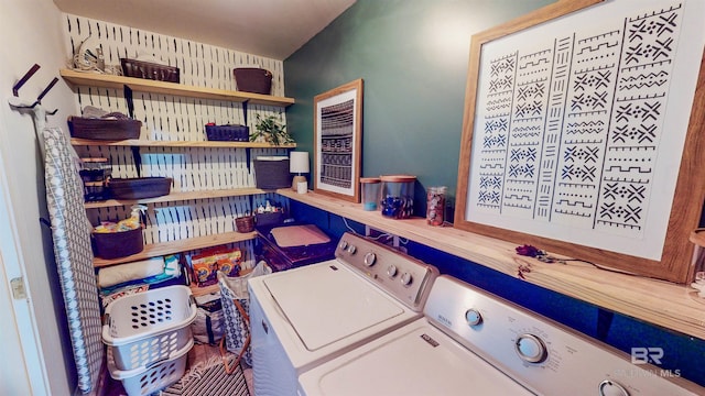 clothes washing area with independent washer and dryer