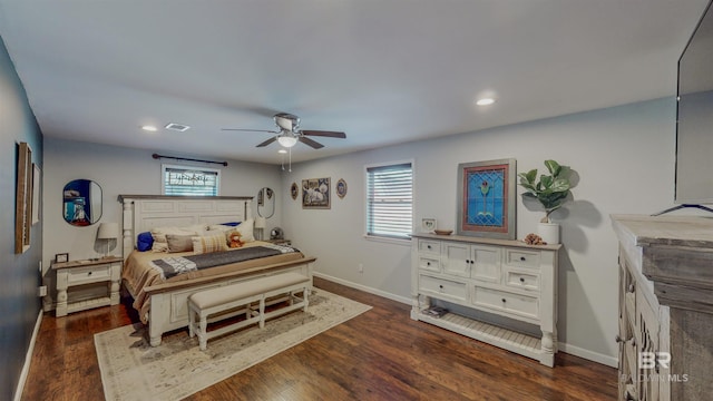 bedroom with ceiling fan and dark wood-type flooring