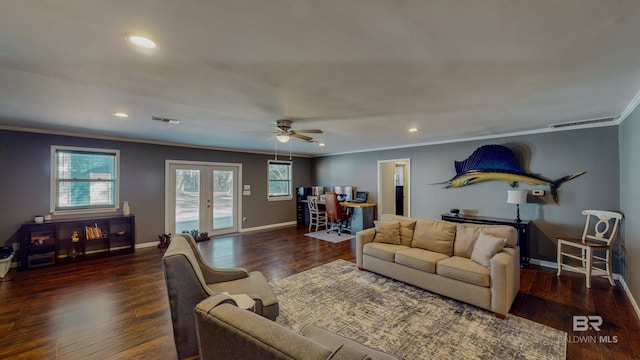 living room with ceiling fan, dark hardwood / wood-style flooring, ornamental molding, and french doors