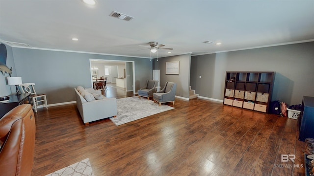 living room with ceiling fan, dark hardwood / wood-style floors, and crown molding