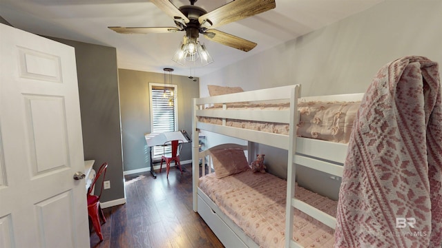 bedroom with ceiling fan and dark hardwood / wood-style floors