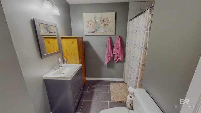 bathroom with tile patterned floors, toilet, and vanity