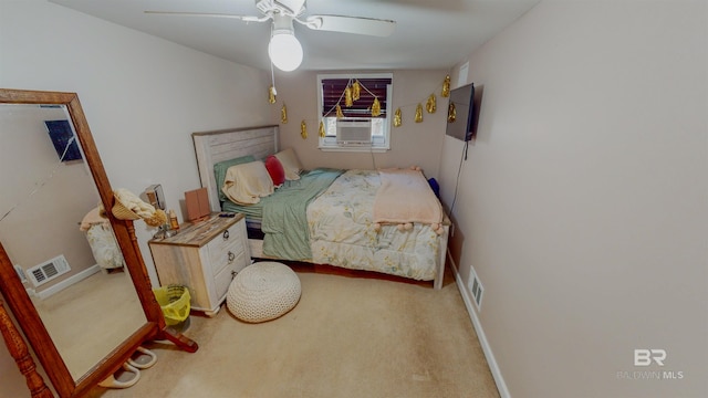 bedroom with ceiling fan, cooling unit, and carpet flooring