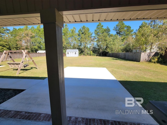 view of patio / terrace with a fenced backyard and a playground