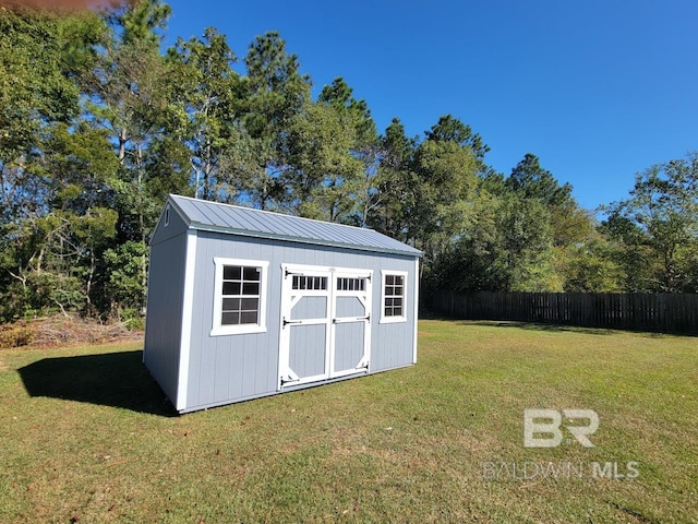 view of shed with fence