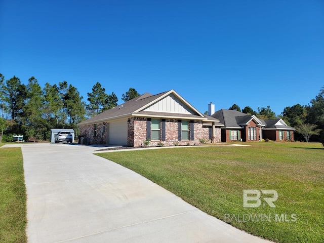 view of front of property featuring a front lawn, board and batten siding, driveway, and a garage