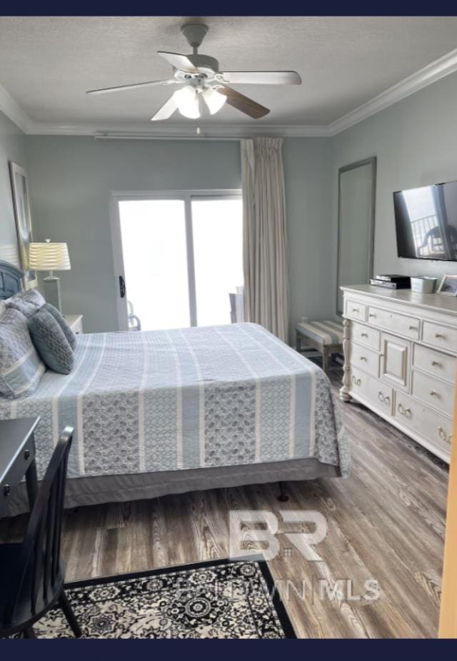401 E Beach Blvd Unit 507, Gulf Shores, AL 36542 - bedroom with wood finished floors, ornamental molding, and a ceiling fan