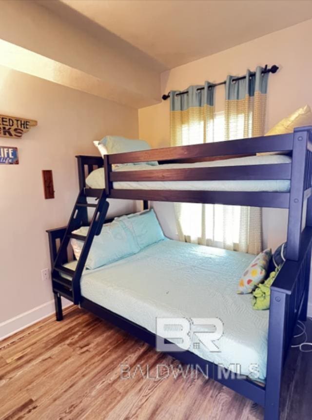 401 E Beach Blvd Unit 507, Gulf Shores, AL 36542 - bedroom with wood finished floors and baseboards