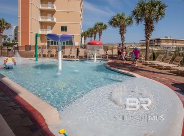 401 E Beach Blvd Unit 507, Gulf Shores, AL 36542 - community pool with a patio area