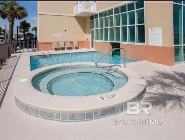 401 E Beach Blvd Unit 507, Gulf Shores, AL 36542 - community pool featuring a hot tub