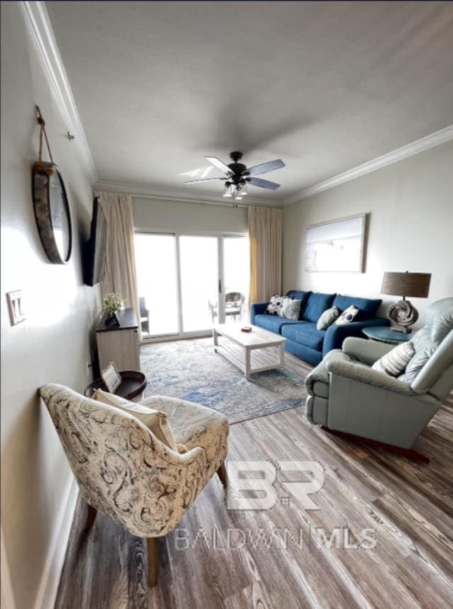 401 E Beach Blvd Unit 507, Gulf Shores, AL 36542 - living area featuring crown molding, wood finished floors, and a ceiling fan