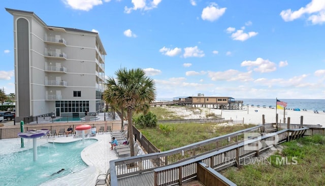 401 E Beach Blvd Unit 507, Gulf Shores, AL 36542 - community pool with view of water and beach and a patio area