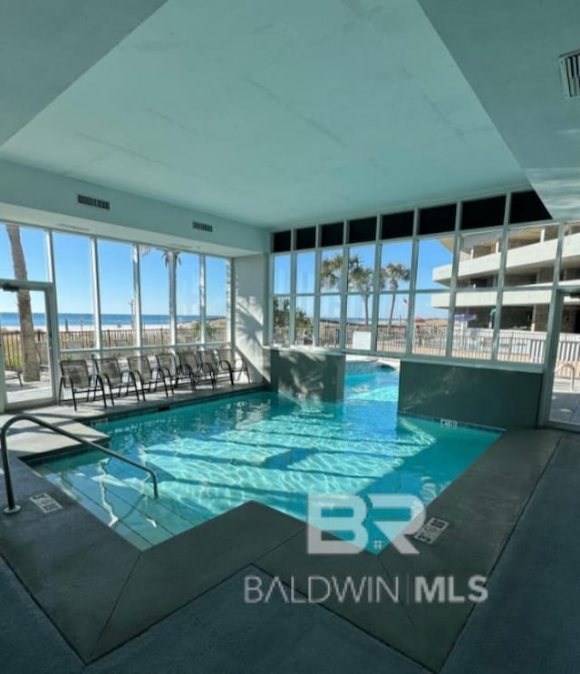 401 E Beach Blvd Unit 507, Gulf Shores, AL 36542 - indoor pool with a patio area