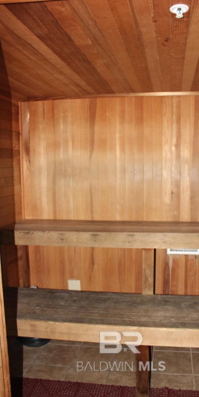 401 E Beach Blvd Unit 507, Gulf Shores, AL 36542 - relaxing sauna with wooden ceiling, wooden walls, and tile patterned floors