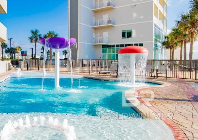 401 E Beach Blvd Unit 507, Gulf Shores, AL 36542 - community pool with a patio