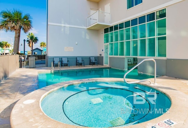401 E Beach Blvd Unit 507, Gulf Shores, AL 36542 - community pool featuring a hot tub and a patio area