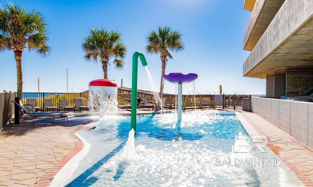 401 E Beach Blvd Unit 507, Gulf Shores, AL 36542 - view of swimming pool with a patio area