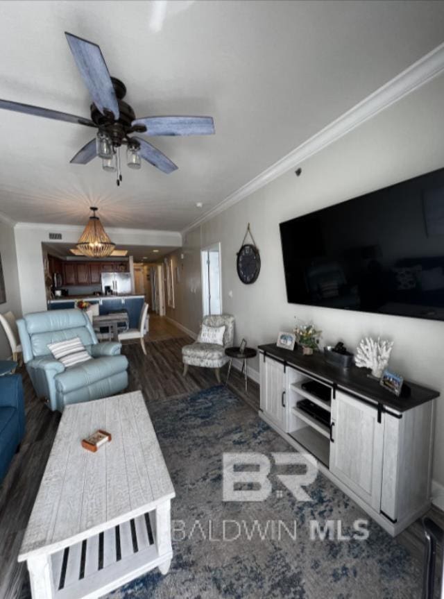 401 E Beach Blvd Unit 507, Gulf Shores, AL 36542 - living room with crown molding, wood finished floors, a ceiling fan, and baseboards