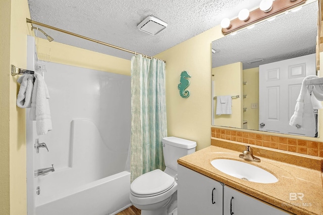 24114 Perdido Beach Blvd Unit 402, Orange Beach, AL 36561 - full bathroom with toilet, tasteful backsplash, a textured ceiling, vanity, and shower / bath combo
