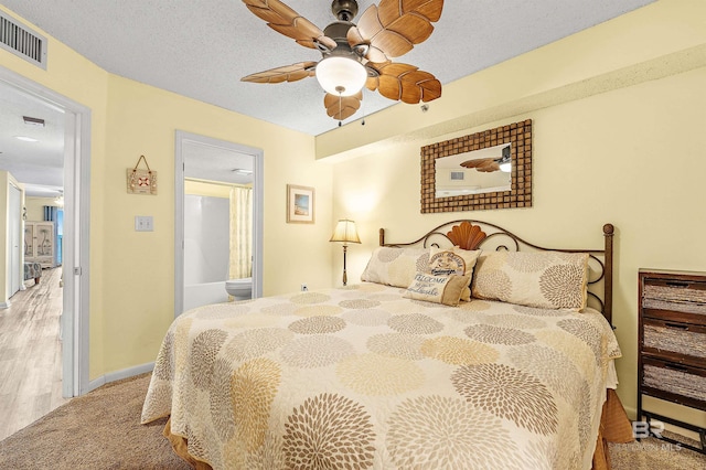 24114 Perdido Beach Blvd Unit 402, Orange Beach, AL 36561 - carpeted bedroom with ceiling fan and a textured ceiling