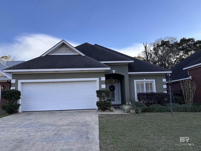 ranch-style home featuring a front lawn and a garage