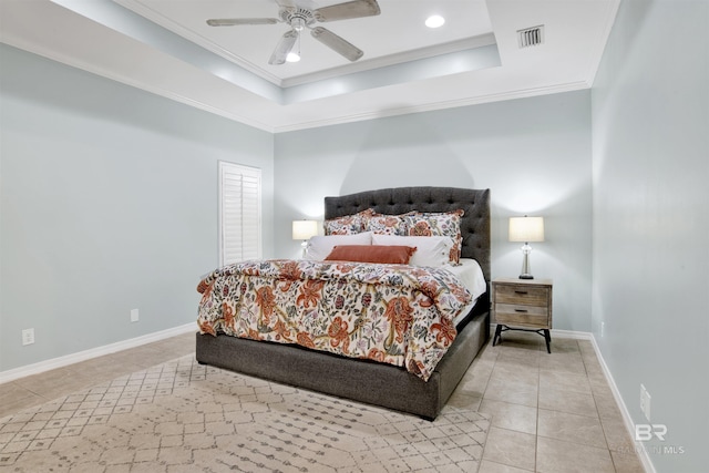 tiled bedroom featuring a raised ceiling, ceiling fan, and crown molding