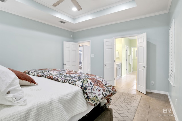 bedroom with crown molding, light tile patterned floors, ceiling fan, and a tray ceiling