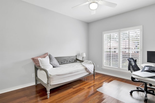 bedroom with wood-type flooring and ceiling fan