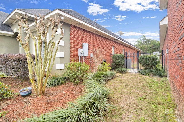 view of home's exterior with a yard