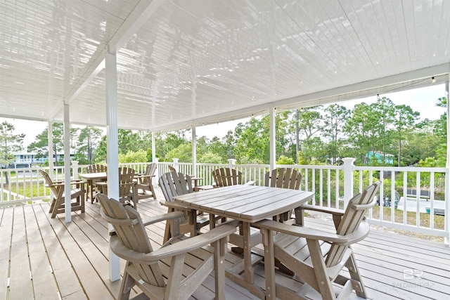 wooden terrace featuring outdoor dining area