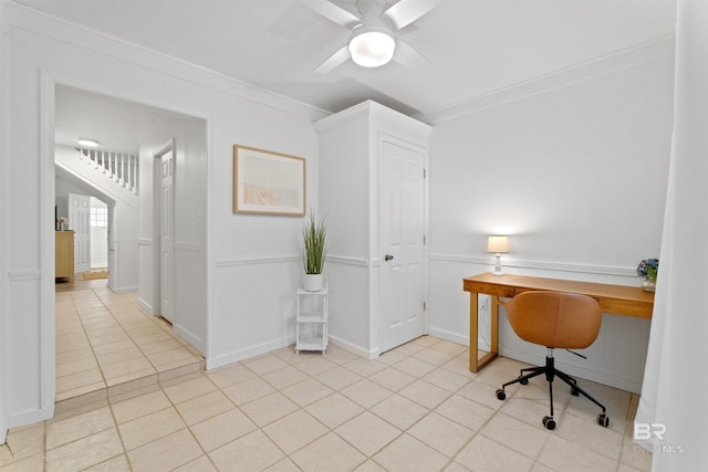 office featuring baseboards, ornamental molding, ceiling fan, built in study area, and light tile patterned flooring