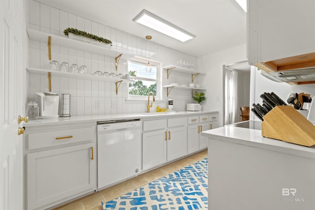 kitchen featuring white cabinets, open shelves, white dishwasher, a sink, and backsplash