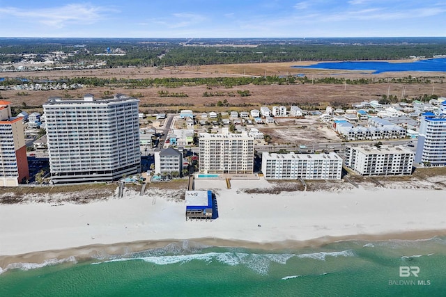 bird's eye view with a beach view, a water view, and a city view