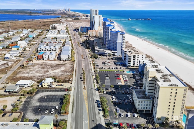 aerial view with a view of city, a water view, and a beach view